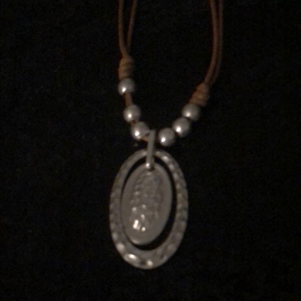 Brown Leather necklace with silver beads and silver pendant.